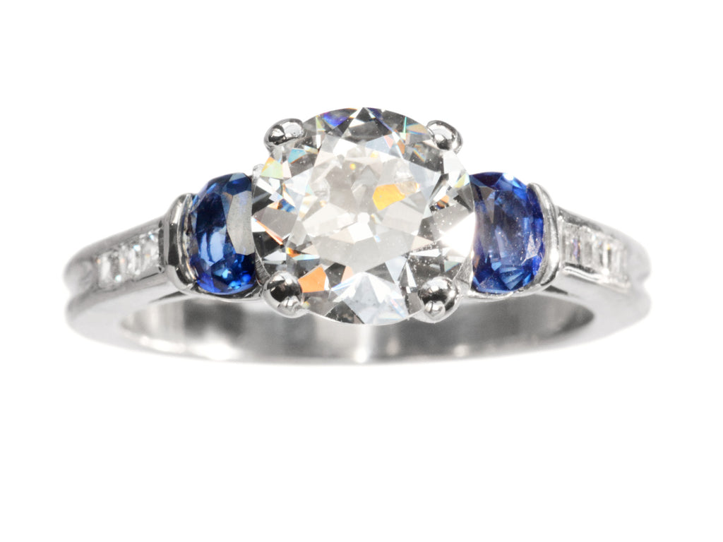 c1930 Art Deco 1.39ct Diamond Engagement Ring with Blue Sapphire Sides in Platinum (shown on white background)