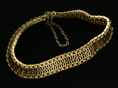 thumbnail of c1880 French 18K yellow gold bracelet with filigreed links, shown on black background