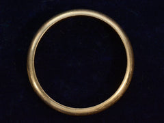 thumbnail of Side profile view of c1950 4.0mm 18K Yellow Gold Wedding Band (on dark blue background)