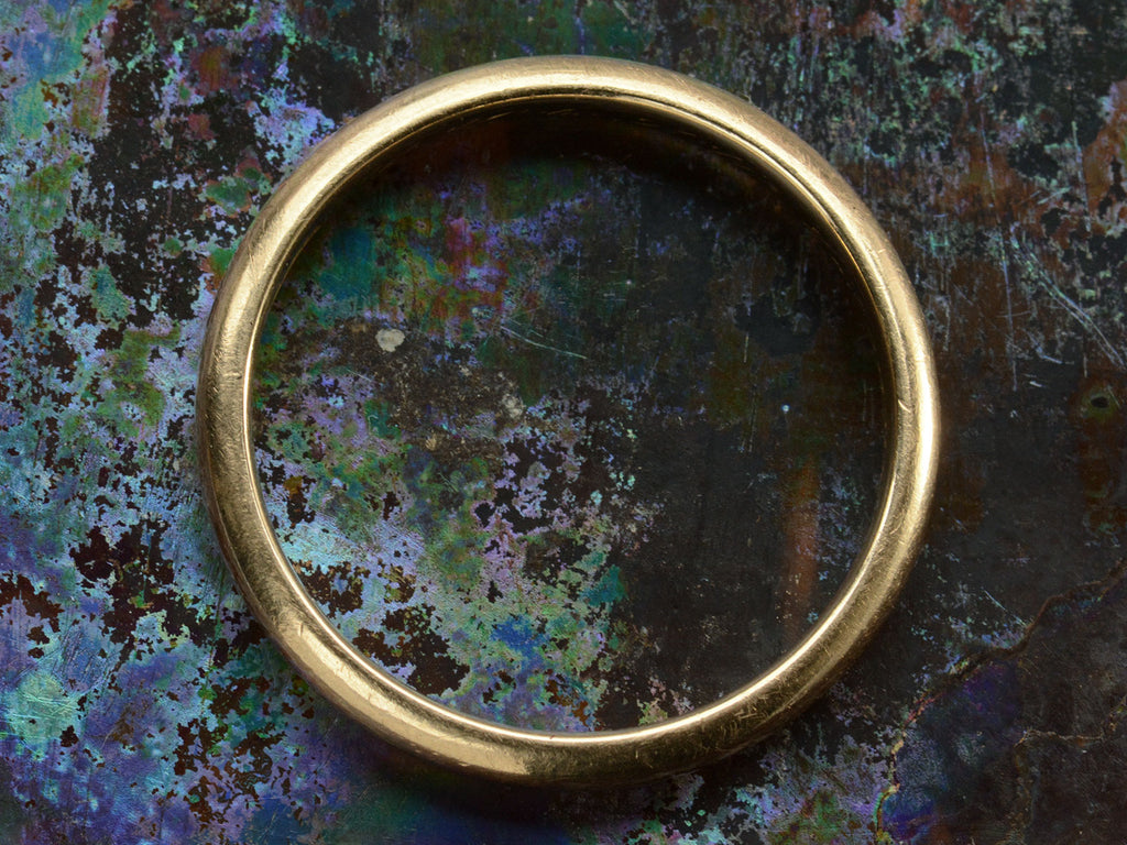 1923 Antique Rounded 3.3mm Men's Wedding Band in 14K Rosy-Yellow Gold (on colorful background)