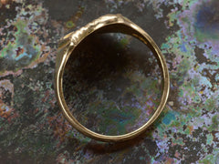 thumbnail of Side profile view of Art Deco yellow gold signet ring with the year "1925" on a shield shaped signet face. Shown on dark background.