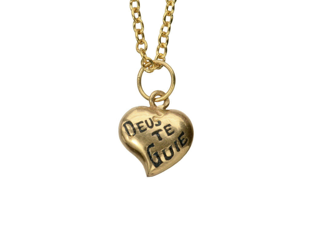 Gold heart-shaped pendant necklace with 'Deus Te Guie' text on a white background.

