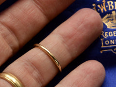 thumbnail of Vintage rounded 2.0mm wide gold wedding band on finger.
