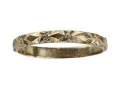 thumbnail of A narrow vintage rosy-yellow wedding band with a pattern of flowers and facets, shown on a white background.