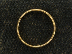 thumbnail of Side profile of an antique rounded 18K yellow gold wedding band, shown on dark textured background.