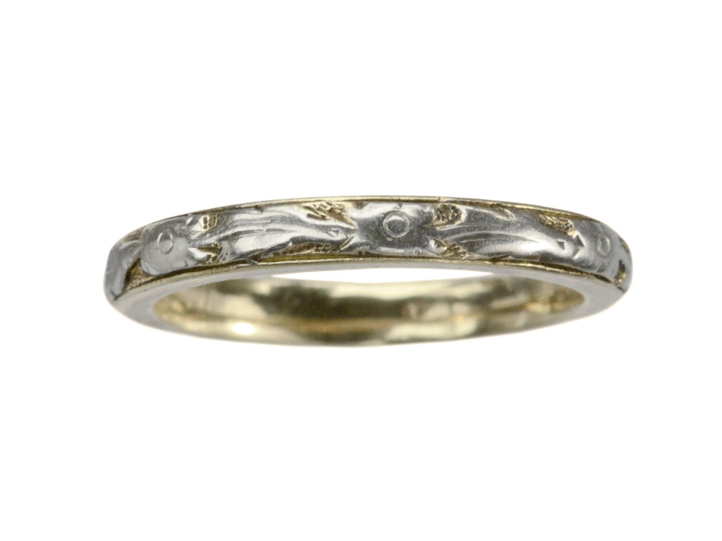 A yellow c1920 Art Deco wedding band with white gold decoration on the outside face, shown on white background.