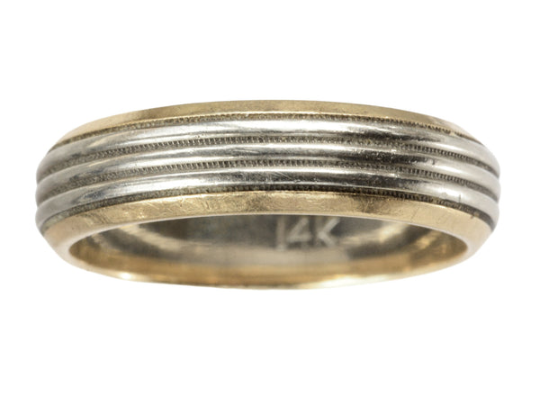 Vintage men's wedding band in yellow gold with center stripes of white gold, shown on white background. "14K" stamp visible inside.