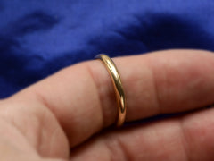 thumbnail of A 3.0mm wide rounded 14K yellow gold men's wedding band shown on finger.