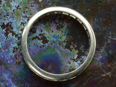 thumbnail of Side profile of c1950 Diamond Eternity Band in Platinum Channel Setting (on colorful background)