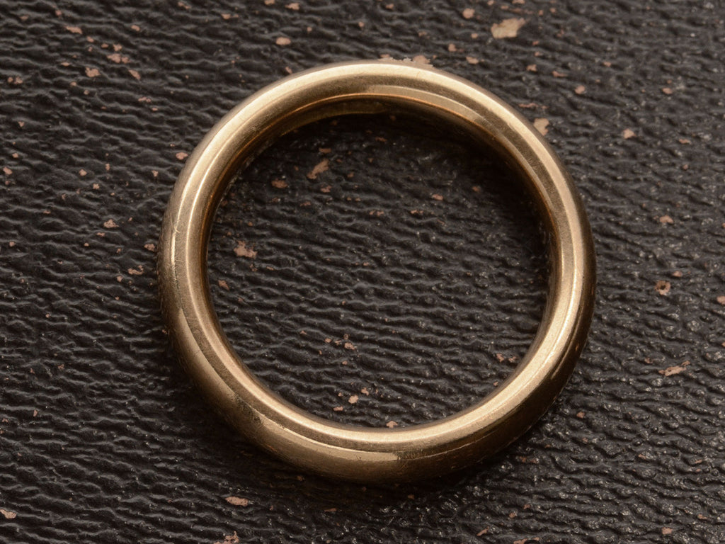 Side profile of a rounded 4.0mm wide antique rosy-yellow gold wedding band, shown on dark background.