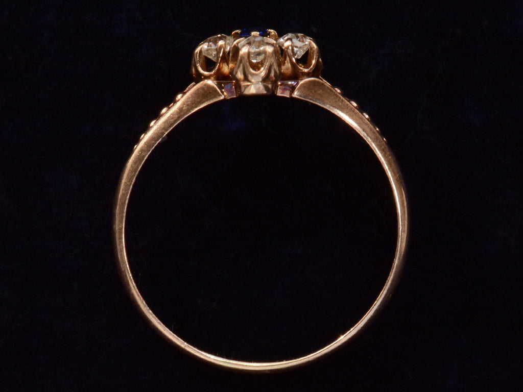 Side profile c1890 Sapphire & Diamond Ring in Rose Gold (on black background)