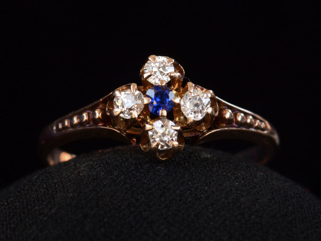 Front view of c1890 Sapphire & Diamond Ring in Rose Gold (on black background)