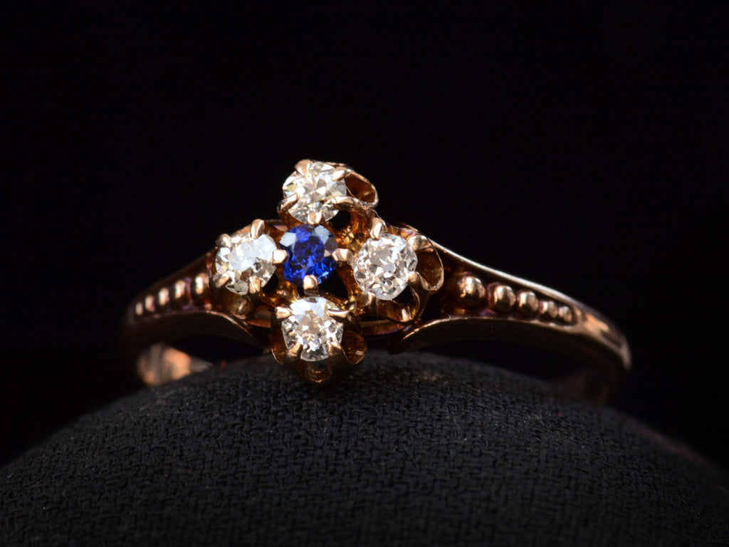 Left angle view of c1890 Sapphire & Diamond Ring in Rose Gold (on black background)