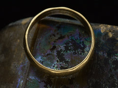 thumbnail of Side profile of a 5.5mm wide vintage men's wedding band with a modeled surface, shown on dark iridescent background. 