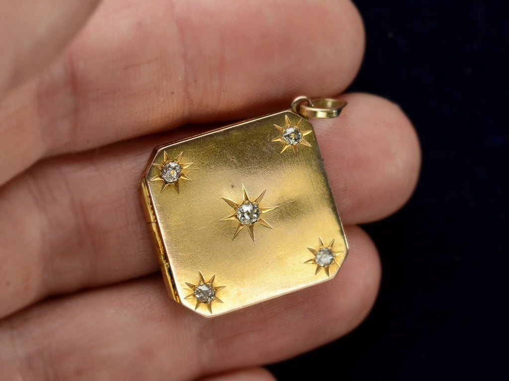 c1900 Diamond-Shaped Five Diamond Locket in yellow gold, shown on  hand for scale.