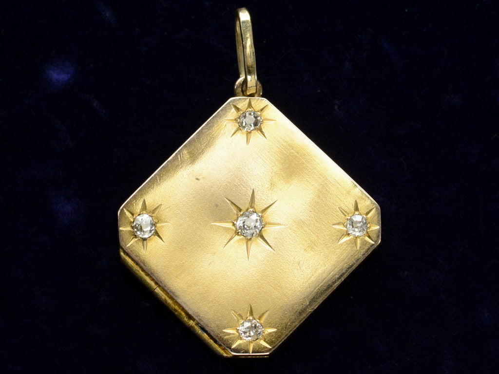 c1900 Diamond-Shaped Five Diamond Locket in yellow gold, shown on dark blue background.