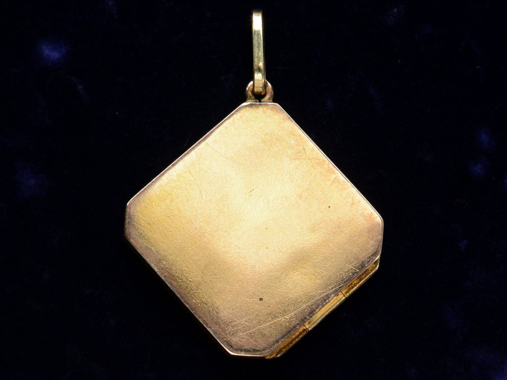 c1900 Diamond-Shaped Five Diamond Locket in yellow gold, reverse side shown on dark blue background.