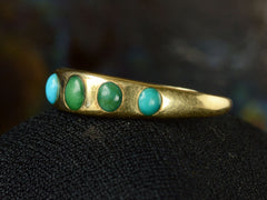 thumbnail of Right side view of c1900 18K Gold Ring with Five Oval Turquoise Cabochons, shown on dark background