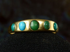 thumbnail of c1900 18K Gold Ring with Five Oval Turquoise Cabochons, shown on dark background