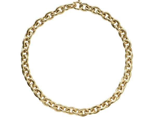 A c1960 14K yellow gold oval chain link necklace, shown on white background.