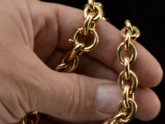 thumbnail of Detail of a c1960 14K yellow gold oval chain link necklace, shown held in hand.