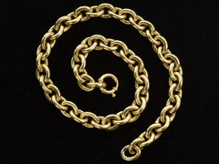 thumbnail of A c1960 14K yellow gold oval chain link necklace, shown spiraled on black background.