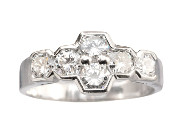 Vintage c1960 white gold ring with a cluster of six diamonds. Shown on white background.
