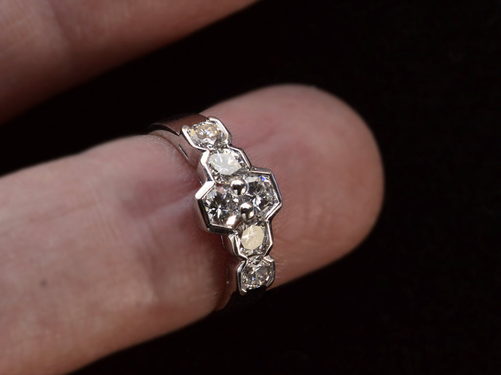 Vintage c1960 white gold ring with a cluster of six diamonds. Shown on finger.