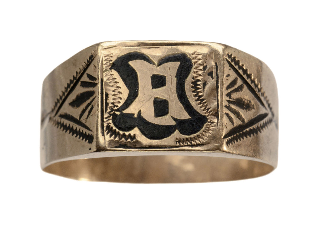 Antique c1890 Victorian signet ring in rose gold with black enamel details and the letter "B" on the face. Shown on white background.