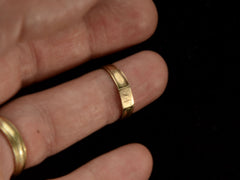 thumbnail of Front view of a petite antique gold signet ring with the letters "I.N" engraved on a rectangular face. Shown on finger.