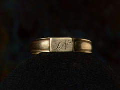 thumbnail of Front view of a petite antique gold signet ring with the letters "I.N" engraved on a rectangular face. Shown on dark background.