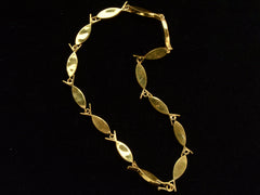 thumbnail of Reverse side of c1970 Gilt Abalone Fish Necklace on Black Background.