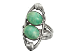 thumbnail of c1910 Arts & Crafts movement ring with a pair of oval green stones in a silver mounting with vines. On white background.