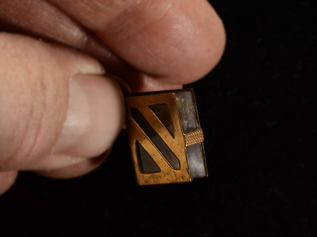 Angled view of c1890 Agate and Yellow Gold Book Pendant (held in fingers)