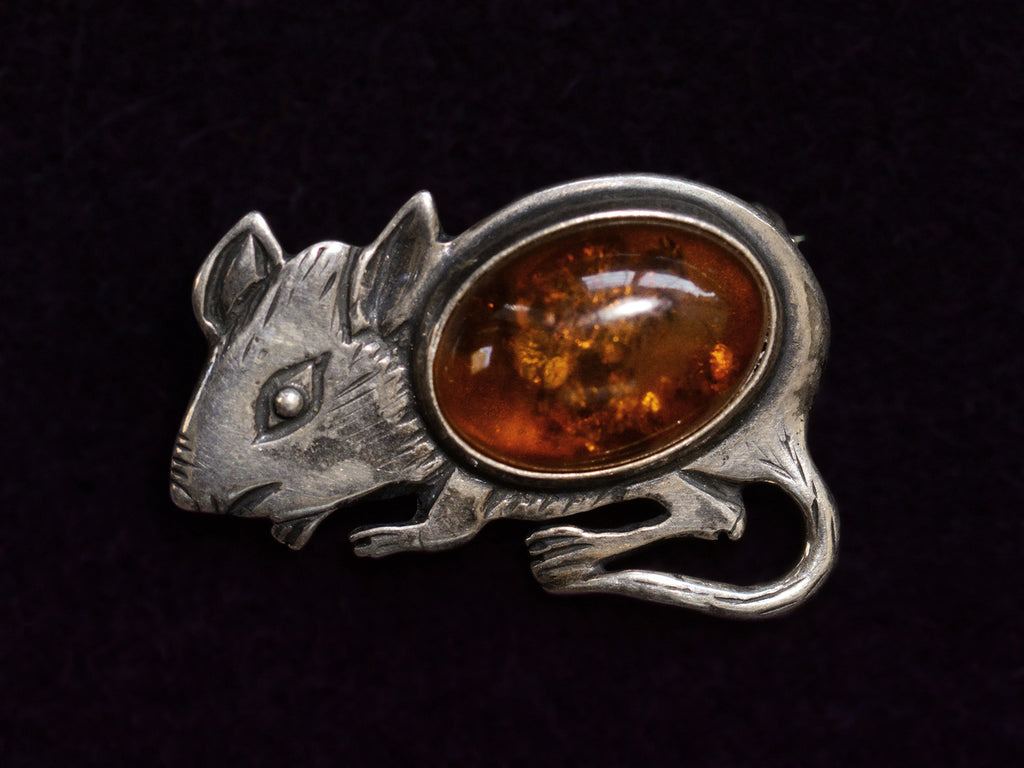 Front side of Vintage Sterling Silver and Amber Mouse Brooch (on dark background)