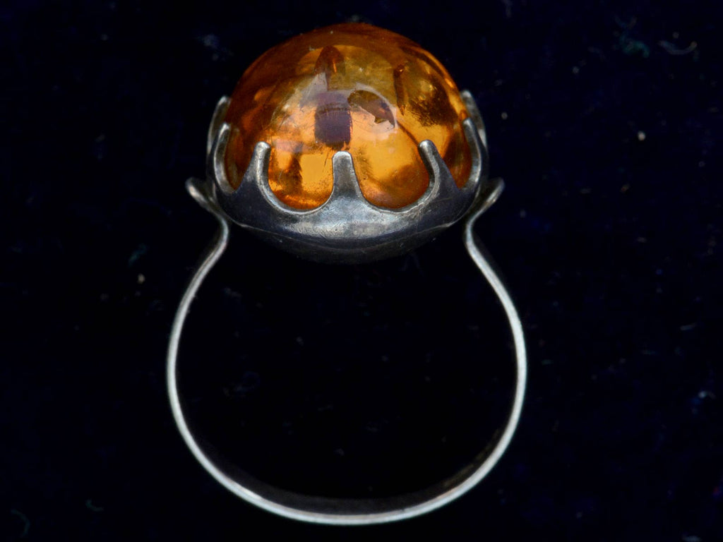 Profile view c1970 Amber and Silver Ring (on black background)