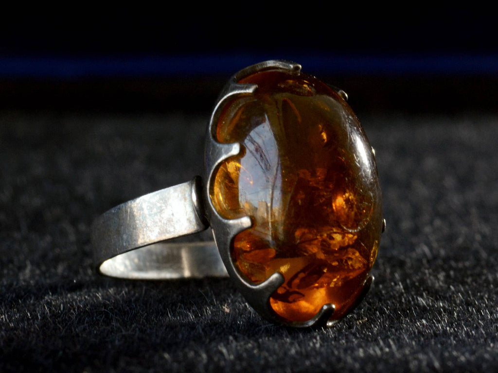 Left angle view c1970 Amber and Silver Ring (on black background)