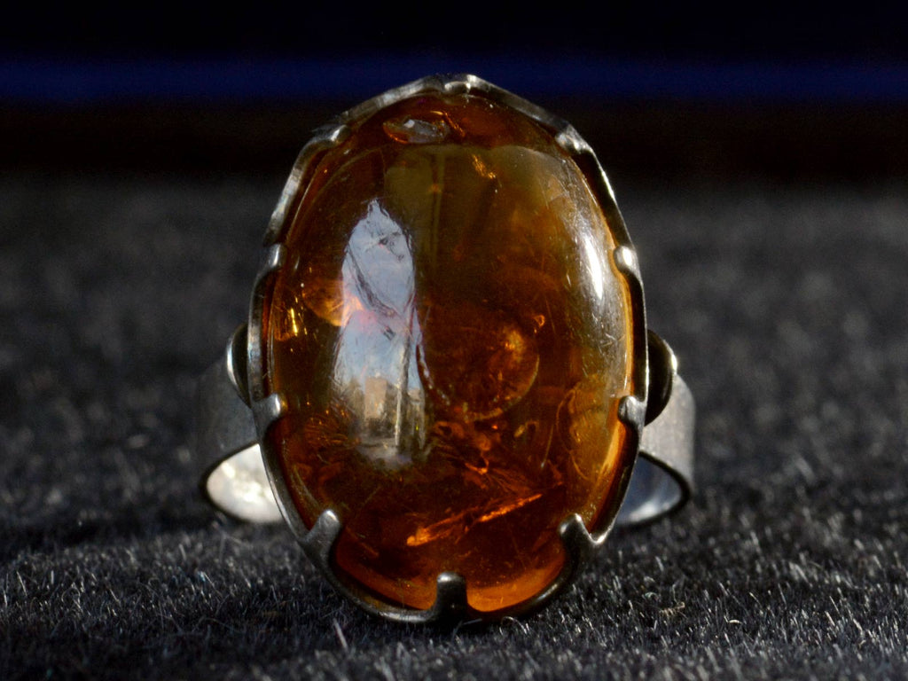 Front view c1970 Amber and Silver Ring (on black background)