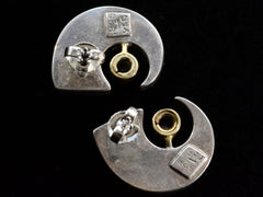 thumbnail of Reverse side of c1990 Silver Claw Stud Earrings with Gold Bezel Mounted Purple Amethysts (on black background). Stamps read "925 YES"