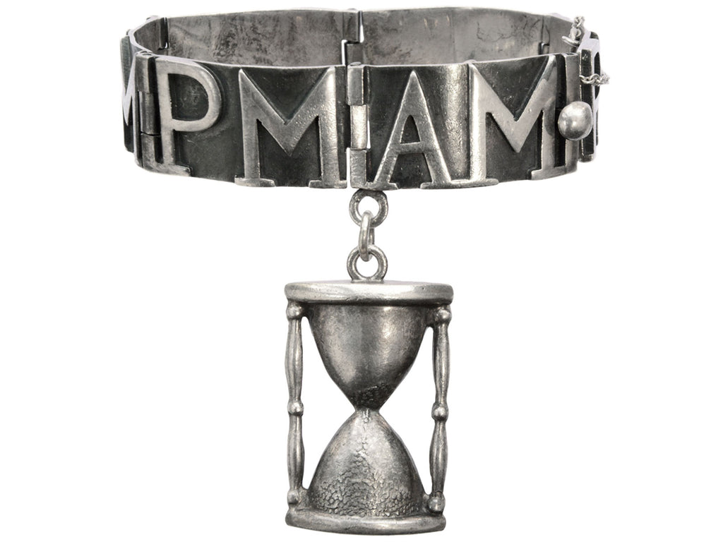 Vintage Margot de Taxco bracelet with "AM" and "PM" panels and an hourglass, shown on white background.