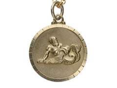 thumbnail of Vintage round gold pendant depicting the water bearer, symbolism for Aquarius. Shown on white background.