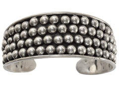 thumbnail of A vintage wide silver cuff bracelet featuring three rows of small, raised silver beads across the front, on a plain white background.