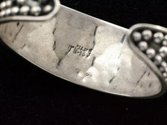 thumbnail of Detail showing stamp inside silver bracelet: "MEXICO TN-33"