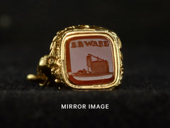 thumbnail of Angled view of Georgian-era gold fob with a carnelian intaglio carved with the word "BEWARE" in and the image of a mousetrap and mouse, shown on dark background. Captioned with "MIRROR IMAGE" indicating that the image has be mirrored to show how the image would look impressed in wax.