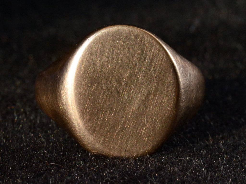 Front detail view of c1910 Gold Signet Ring (on dark background)