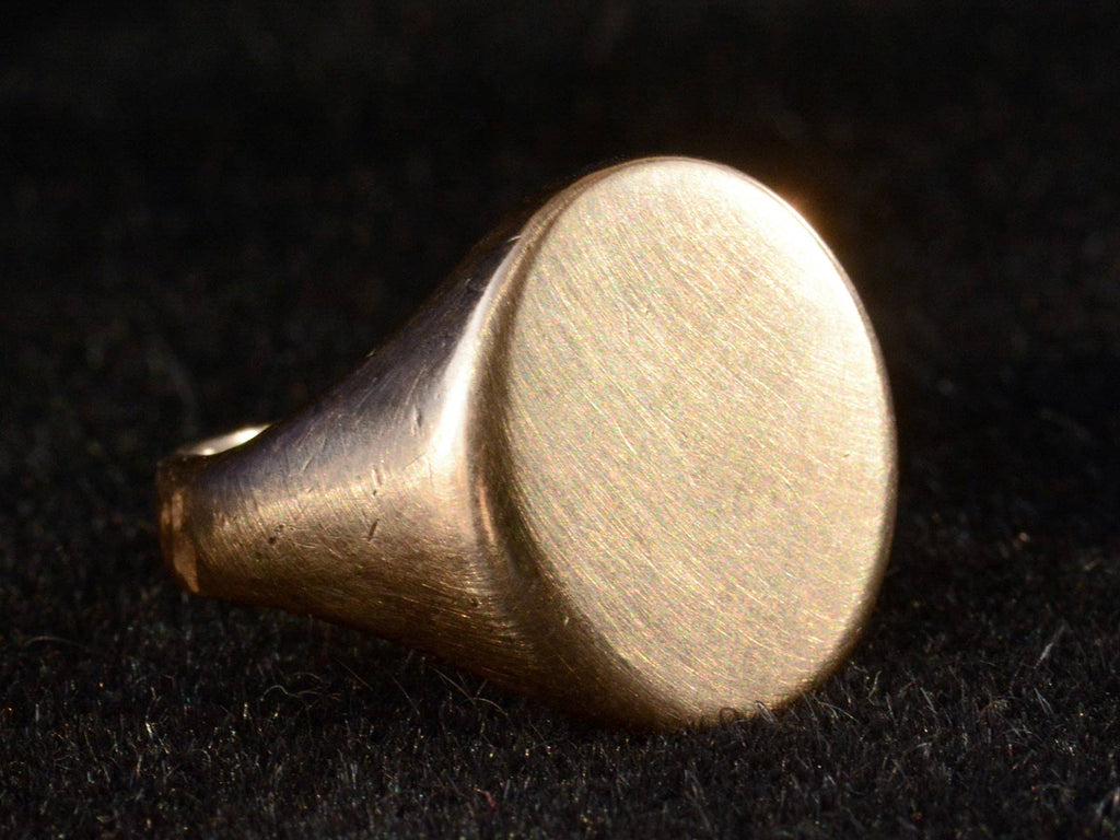 Left angle view of c1910 Gold Signet Ring (on dark background)