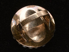 thumbnail of Inside view of Victorian ring with a large luster pearls and rose cut diamonds, set in rosy-yellow gold, shown on dark background.