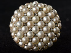 thumbnail of Front profile view of Victorian ring with a large luster pearls and rose cut diamonds, set in rosy-yellow gold, shown on dark background.