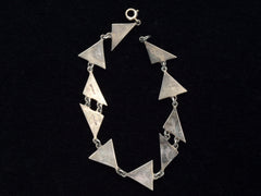thumbnail of Reverse side of Art Deco silver bracelet with triangle links on a black background
