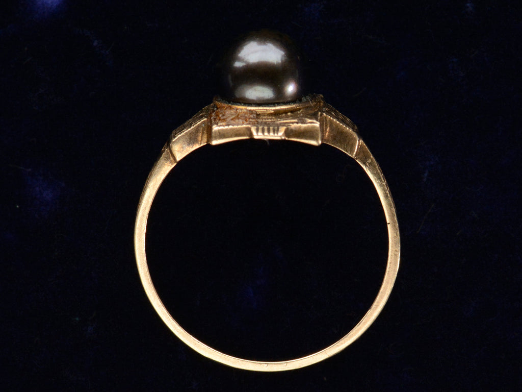 c1920 Art Deco black pearl ring in yellow gold (side profile shown on dark purple background)